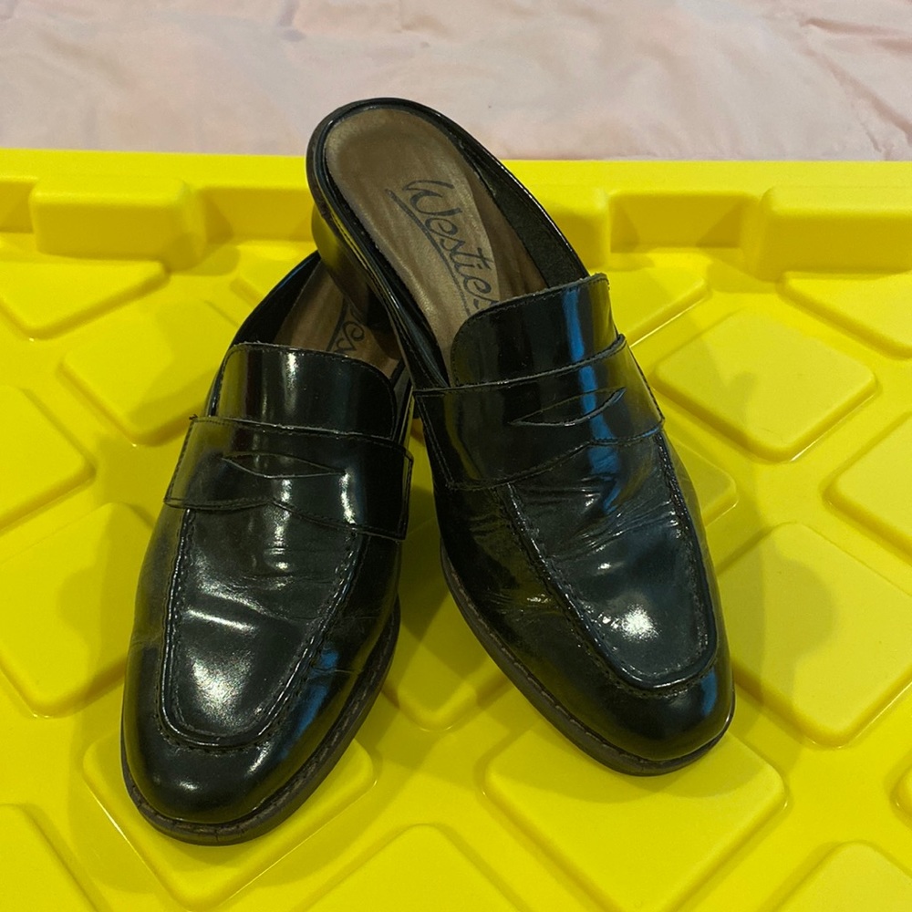 Black patent leather mules by Westies